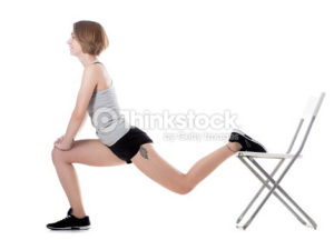 Young cheerful sporty attractive woman doing fitness training, exercises for hips and buttocks with office chair, full length isolated studio image on white background